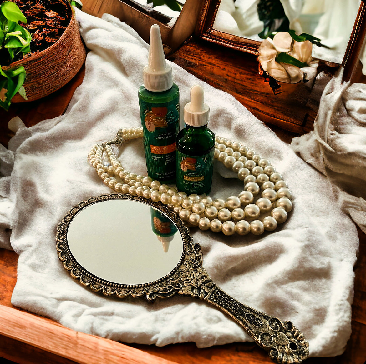 Image of The Hydraloc Power18 Serum and the Hydraloc Cooling Creme on a wooden vanity.