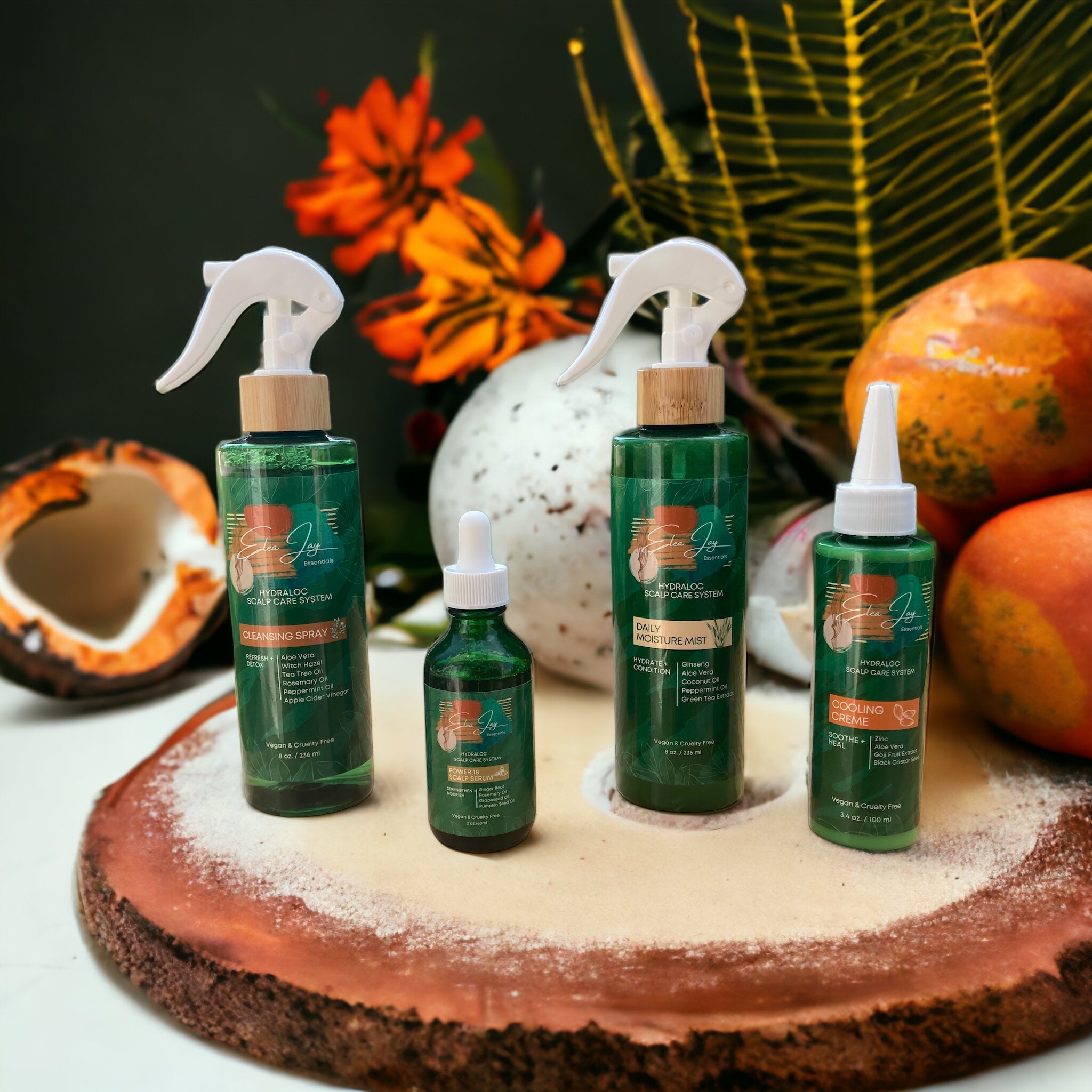 Image of The Hydraloc Scalp Care Collection on wood plank surrounded by tropical scenery